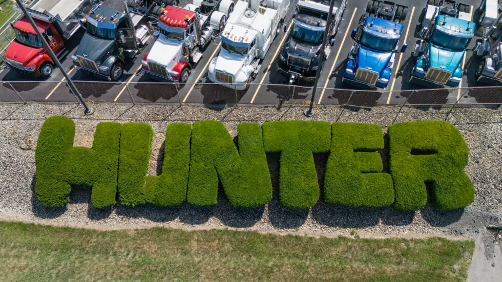 Aerial view of green shrubs trimmed in a way that spells 'Hunter'