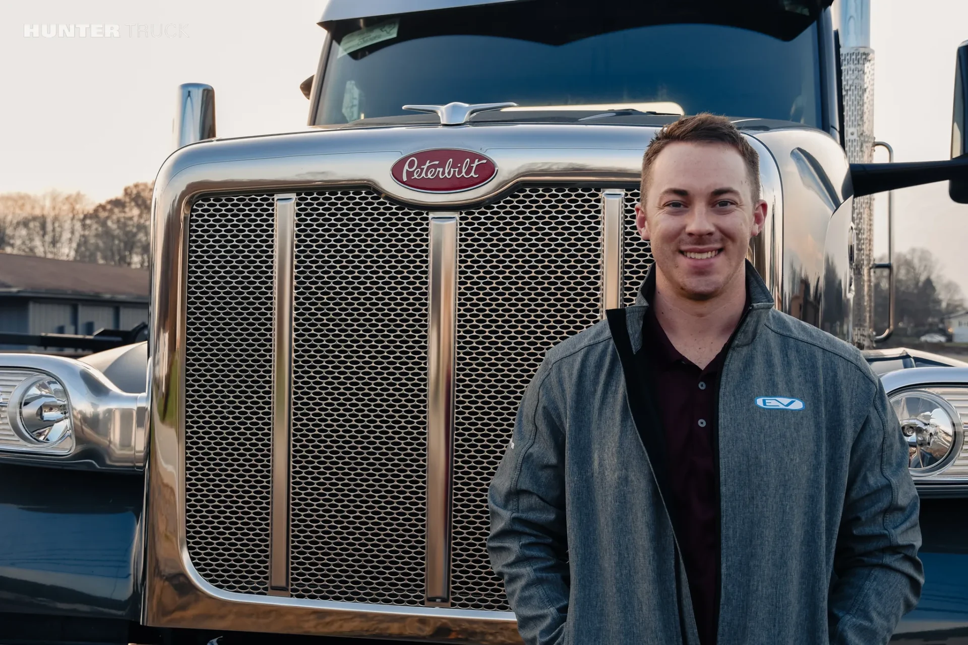 Truck Sales Manager of Hunter Truck - Butler posing in front of a truck in the winter
