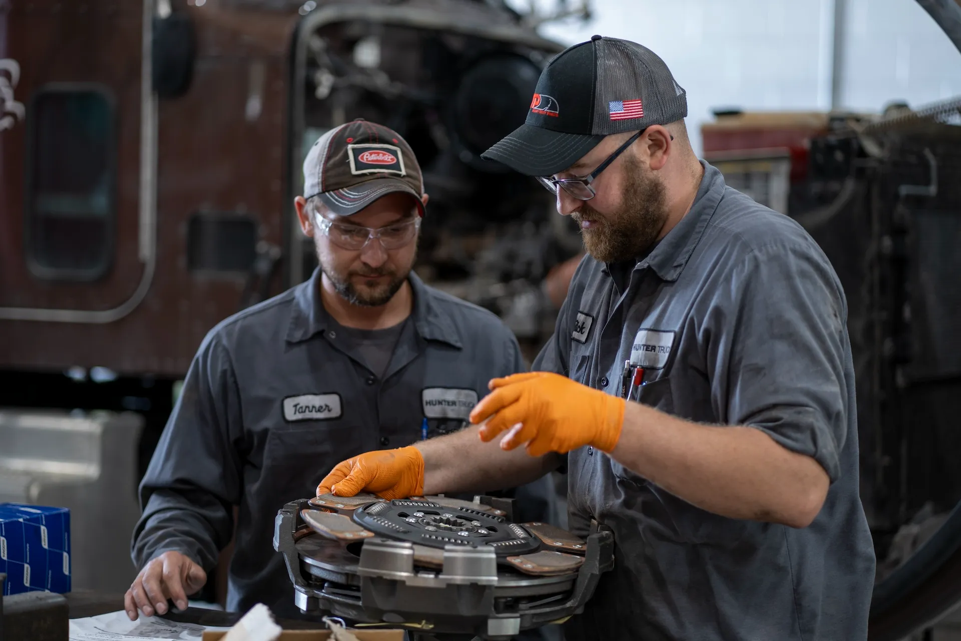 two techs working on a truck